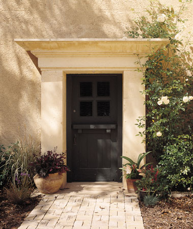 Through this dramatic entryway, crowned with a cast-earth pediment, is the future of rammed-earth construction. It’s also a preview to David Easton’s courtyard compound, which includes the charming guest house with kiwi-covered arbor (shown opposite).